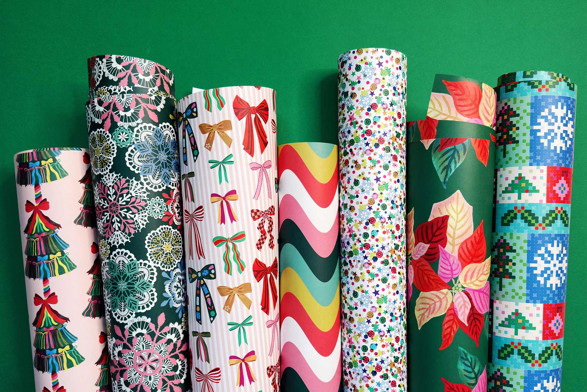 A variety of colorful Christmas holiday gift wrap designs